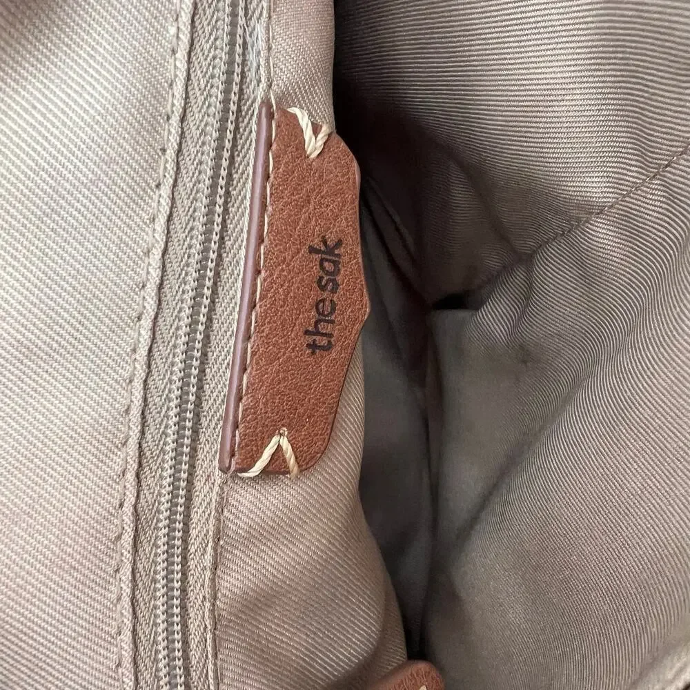 The Sak top zip crossbody bag back zip neutral colors every day travel bag